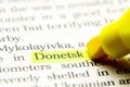 Word DONETSK is select in yellow marker on paper