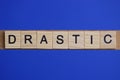 Word drastic made from wooden gray letters