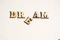 Word Dream written on white background close-up. Broken dreams Royalty Free Stock Photo