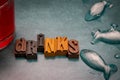 The word Drinks in wooden typeface