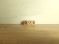Word due from wooden blocks Royalty Free Stock Photo