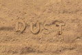 the word dust embossed on dusty road surface in flat lay perspective