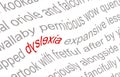 The word dyslexia printed on a piece of white paper, spelled incorrectly