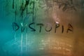 The word dystopia handwritten on wet window glass surface