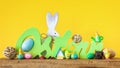 Word Easter in german language with easter bunny eggs and chicks Royalty Free Stock Photo