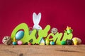 Word Easter in german language with easter bunny eggs and chicks