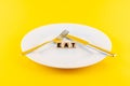 Word 'eat' on wooden blocks on a plate Royalty Free Stock Photo