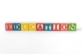 The word Education spelled with toy blocks