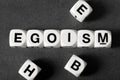 Word egoism on toy cubes