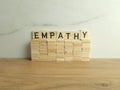 Word empathy made from wooden blocks. Business communication