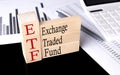 Word ETF made with wood building blocks, business concept Royalty Free Stock Photo