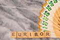 Word EURIBOR Is Written In Wooden Letters, Near Part Of 50 Euro Banknotes. High quality photo