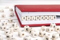 Word Evidence written in wooden blocks in notebook on white wood Royalty Free Stock Photo