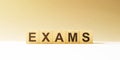 Word EXAMS made with wood building blocks Royalty Free Stock Photo