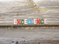 Word Excellence on wood Royalty Free Stock Photo