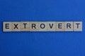 Word extrovert from brown wooden letters