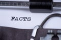 The word Facts written on an old typewriter Royalty Free Stock Photo