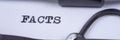 The word Facts written on an old typewriter. Panorama Royalty Free Stock Photo