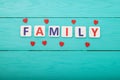 Word family with hearts on blue wooden background. Mock up. Copy space