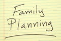 Family planning on a yellow legal pad