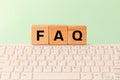 The word FAQ Frequently asked questions, used on the Internet, in online stores or offices, answering standard queries, Inscriptio