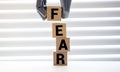 the word FEAR on wood blocks, concept