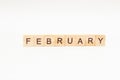 Word February made of wooden blocks on white background. Month of year