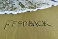 Word feedback in the sand Royalty Free Stock Photo