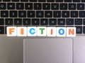 Word Fiction on keyboard background