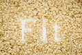 Word Fit written in oat flakes Royalty Free Stock Photo