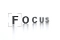 The word FOCUS with focus in the foreground and a blurred background. Interface viewfinder. Video camera focusing screen. Camera