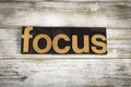 Focus Letterpress Word on Wooden Background