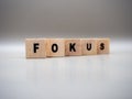 The word FOKUS written on wooden cubes