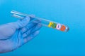 Word food in test-tube holding a gloved hand Royalty Free Stock Photo