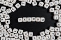 Word FREDOM on wooden cubes on a black wooden table Royalty Free Stock Photo