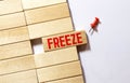 word Freeze on wooden block, business concept Royalty Free Stock Photo