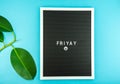 The word FRIDAY on a letter board with happy smiley emoji