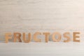 Word Fructose made of wooden letters on table Royalty Free Stock Photo
