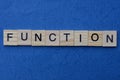 Word function from small gray wooden letters