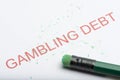Word `Gambling Debt` with Worn Pencil Eraser and Shavings Royalty Free Stock Photo