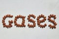 The word Gases laid out from beans