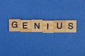 Word genius from brown wooden letters Royalty Free Stock Photo