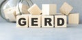 Word GERD Gastroesophageal reflux disease from cubes. Royalty Free Stock Photo