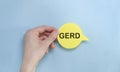 word GERD written in hand on a yellow piece of paper Royalty Free Stock Photo