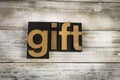 Gift Letterpress Word on Wooden Background Royalty Free Stock Photo