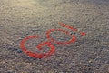 Word GO! written on the asphalt, ground. Red color of chalk.