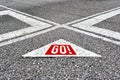 The word go written on asphalt road with direction arrows. Moving forward or making a start in business or life Royalty Free Stock Photo