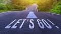 Word Go written on road in the middle of empty asphalt road for business planning strategies and challenges or career path Royalty Free Stock Photo