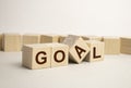 The word goal Concept image of SWOT analysis in business management. Putting wood cubes with alphabets and icons. Top view of wood Royalty Free Stock Photo