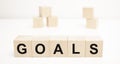 the word GOALS is written on a wooden cubes structure. blocks on a bright white background Royalty Free Stock Photo